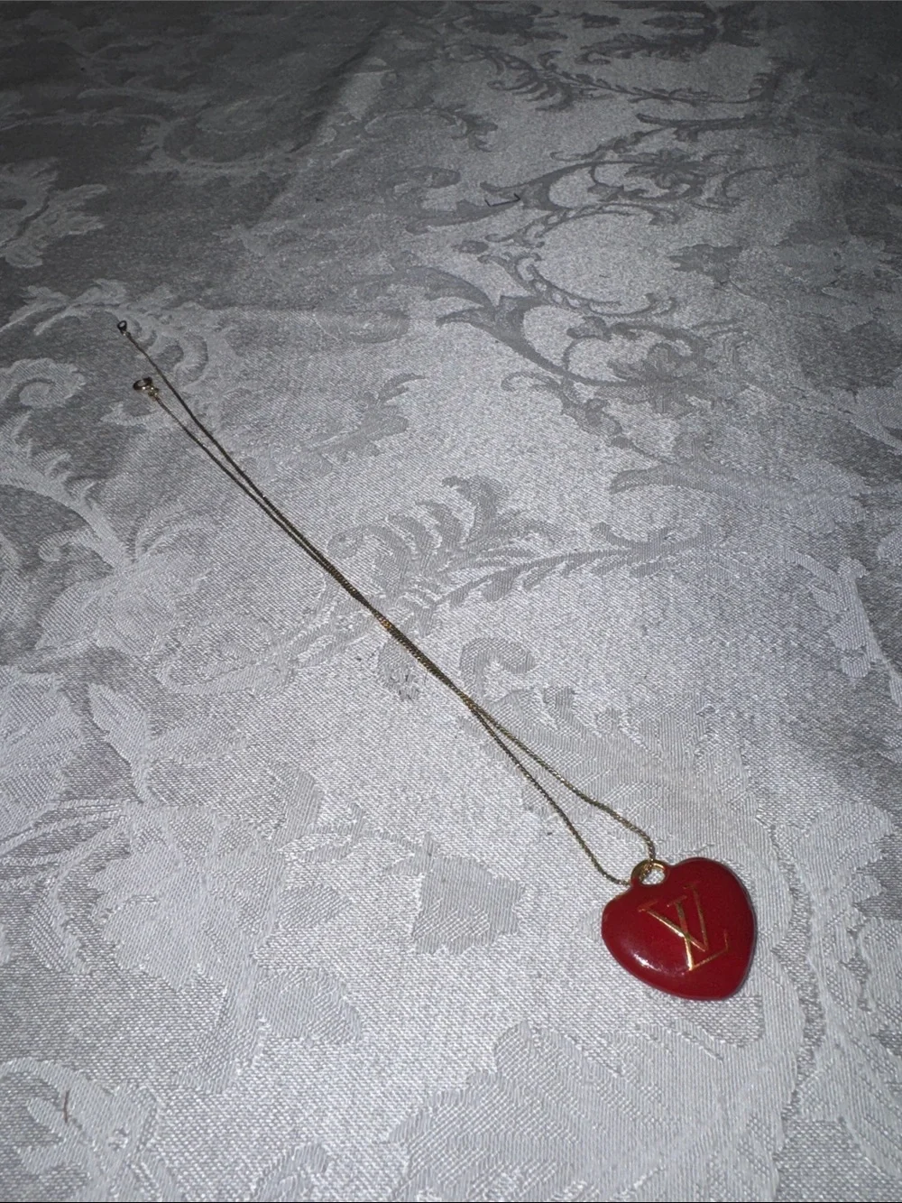 Louis Vuitton Gold-Tone Chain with Red Heart LV Pendant